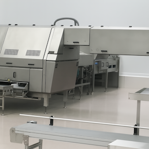 Stainless steel food processing machine in a clean industrial facility, featuring smooth surfaces, ventilation panels, and connected conveyor systems